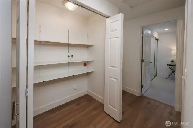 Pantry space adjacent to the kitchen.