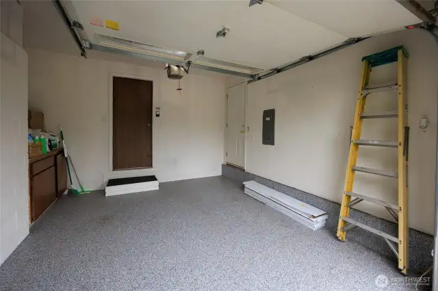 Attached garage is too small for a car, but great for storage and has an epoxy floor coating.