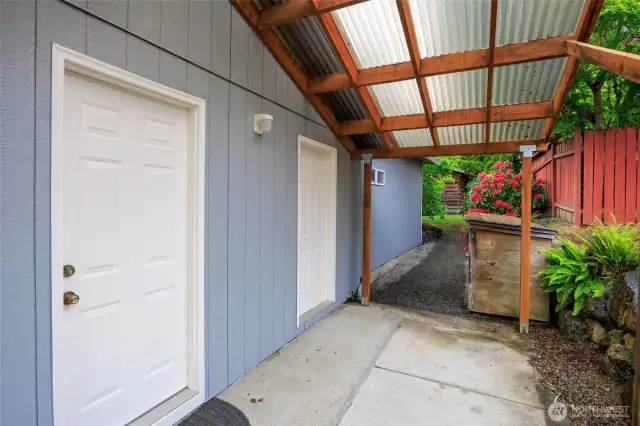 Covered area off garage.