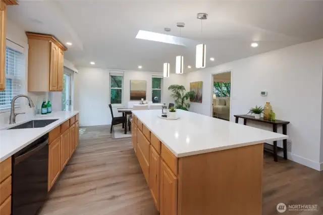Amazing kitchen is a chef's delight with new quart countertops, newer stainless steel appliances, tons of storage, skylight, designer lighting and generous dining space.