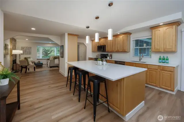 Amazing kitchen is a chef's delight with new quart countertops, newer stainless steel appliances, tons of storage, skylight, designer lighting and generous dining space.