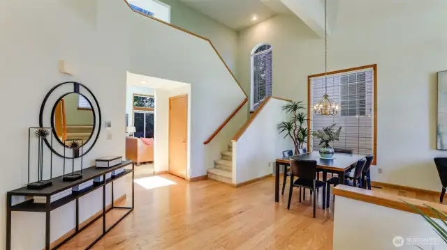 As you enter the home this gorgeous view greets you with  beautifully designed entry with soaring ceilings and engineered hardwood floors.