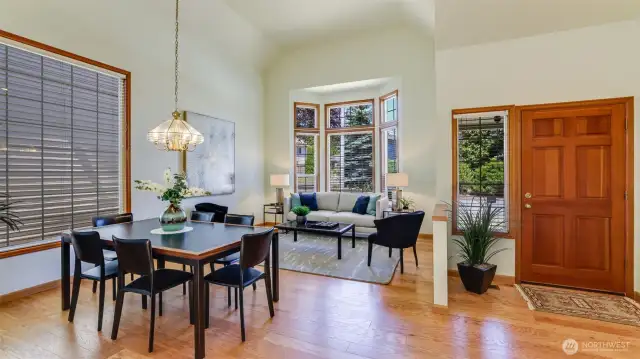 The entry way is added to the previous picture showing the tall ceilings and natural light.