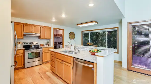 The kitchen has been beautifully updated with new Cambria Quartz countertops, tile backsplash, newer stainless steel appliances and the washer dryer remain with the home.
