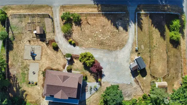 Garden area, play area, fire pit, animal barn with chicken coop and 3 animal runs.