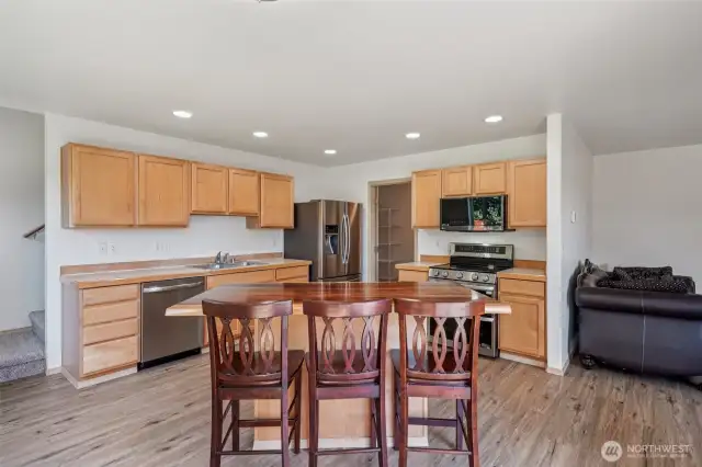 Kitchen with island.. very cool slab wood top.