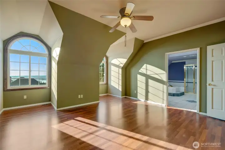 Just imagine the most beautiful sunsets from this primary upstairs!