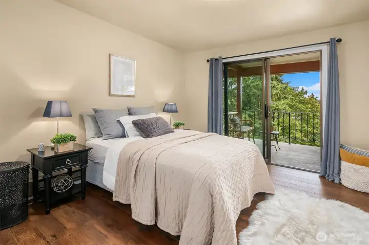 Primary bedroom with sliders to the deck.