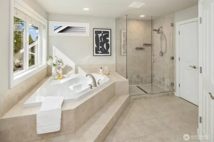 Spa Primary bath with soaking tub and large shower.  Multiple closets offer plenty of storage.