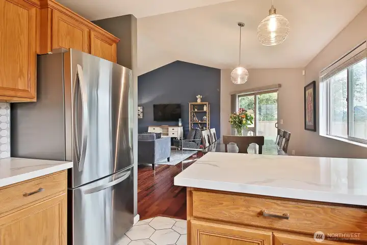 Looking out from kitchen to dining room - and slider to outside. Next we are heading to the primary suite - take a left from kitchen and left again...