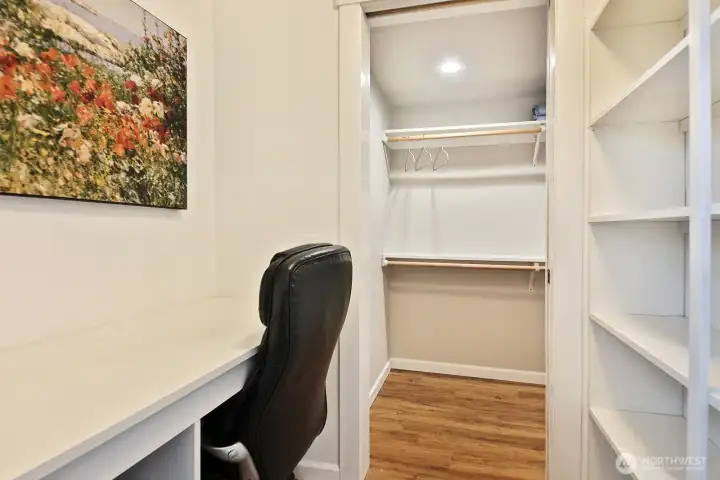 A closer look at the inside the updated walk-in closet is a built in work space.