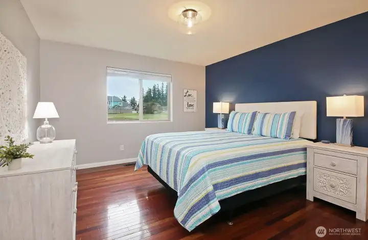 Second bedroom upstairs...both rooms are very spacious and enjoy views of the golf course and lots of light filtering into the room.