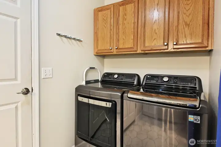 Newer washer and dryer that stay with the home - updated sink and 1/2 bath next pictures.