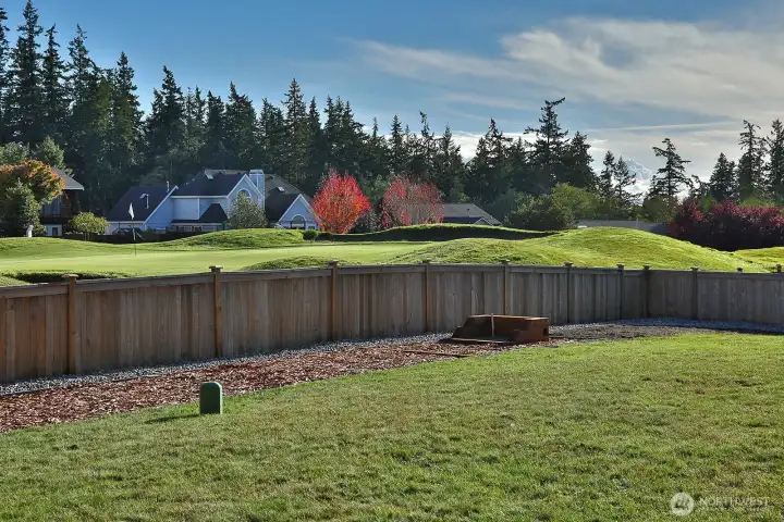 Fencing keeps pups and kids in from the golf course and golfers going by!