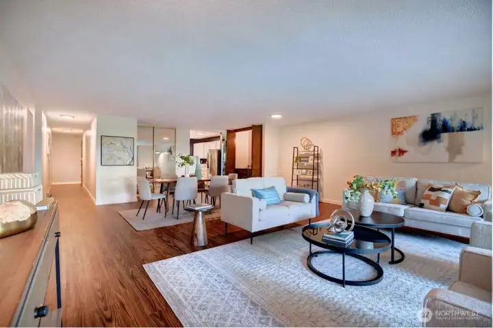 Living room view looking into hallway and kitchen