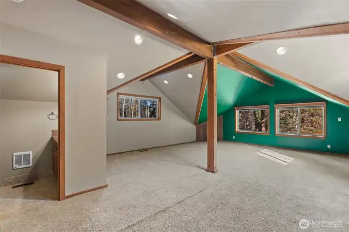 Soaring ceilings in game room or guest suite