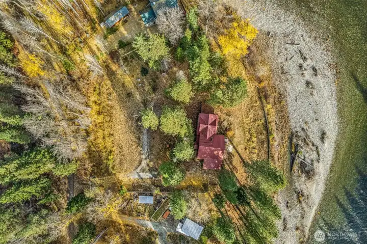 Red metal roof view of property