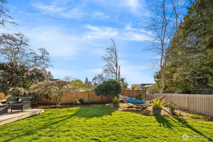 Large fenced back yard, alley access.