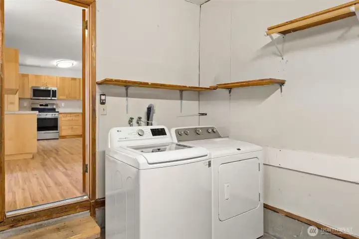 Garage access conveniently off the kitchen with laundry space.