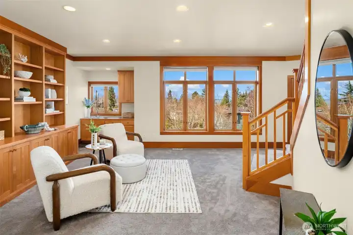 Family room on middle level boasts built ins and views