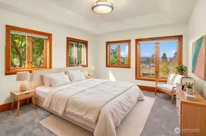 Comfortable bedroom on middle level with coved ceiling (virtual staging)