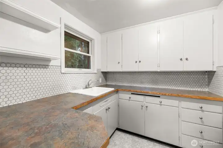 Well-designed kitchen maximizing counter space for functionality and convenience.