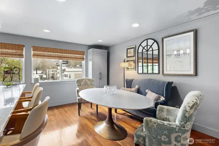 Window-wrapped dining with views & blinds you can control!