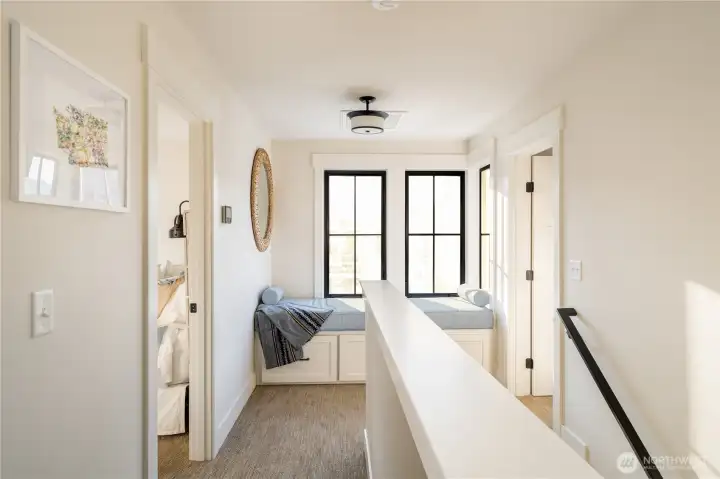 Upper level landing with built in window bench.
