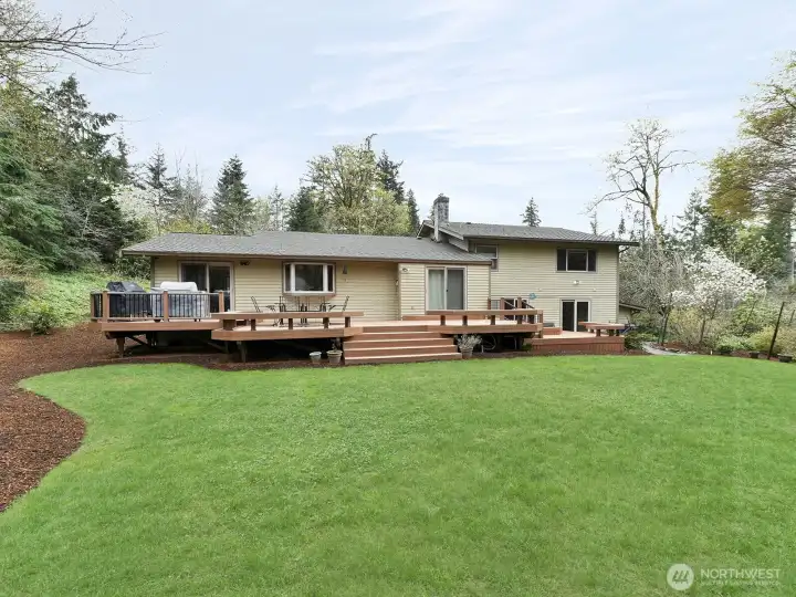 Beautifully manicured yard!  How about that deck?!