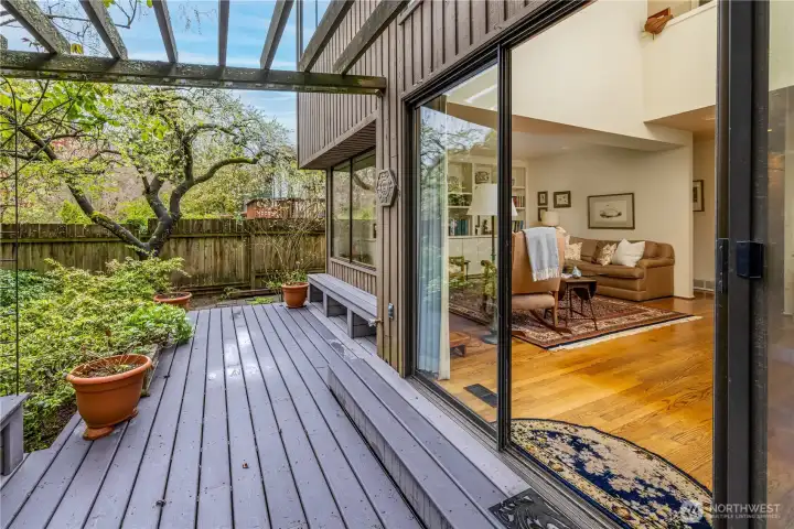 The entertainment-sized deck offers a private outdoor retreat, surrounded by lush, mature landscaping and a fully fenced yard. Perfect for gatherings or quiet moments, it provides ample space for dining, relaxing, and gardening, with a seamless connection to the living area for effortless indoor-outdoor living.