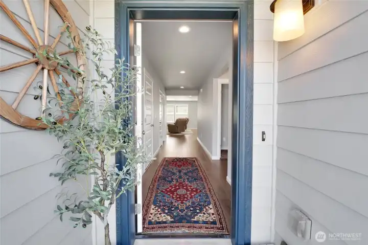 Charming covered front porch with attractive lighting, and inviting curb appeal.