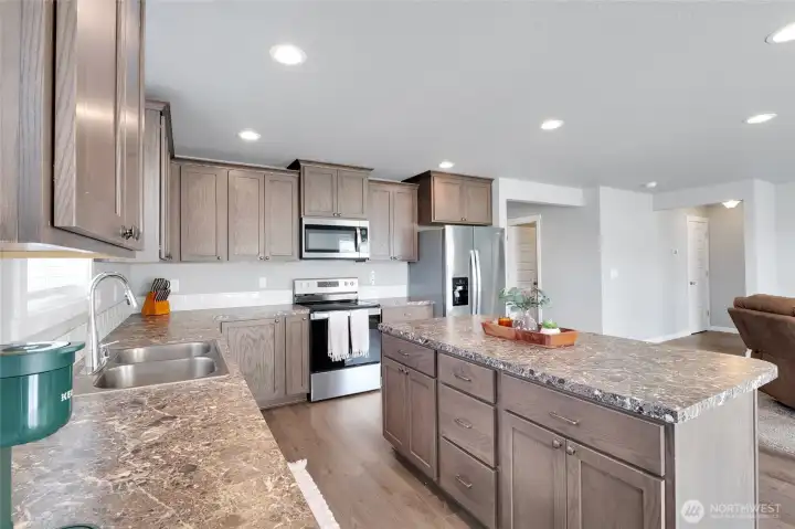 Angle from dining area showing the expansive kitchen.