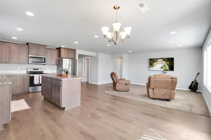 Open concept layout seamlessly connecting the kitchen, dining and living area.
