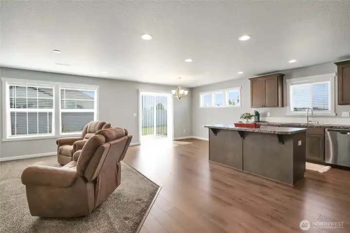 Wide view of kitchen and eating space.
