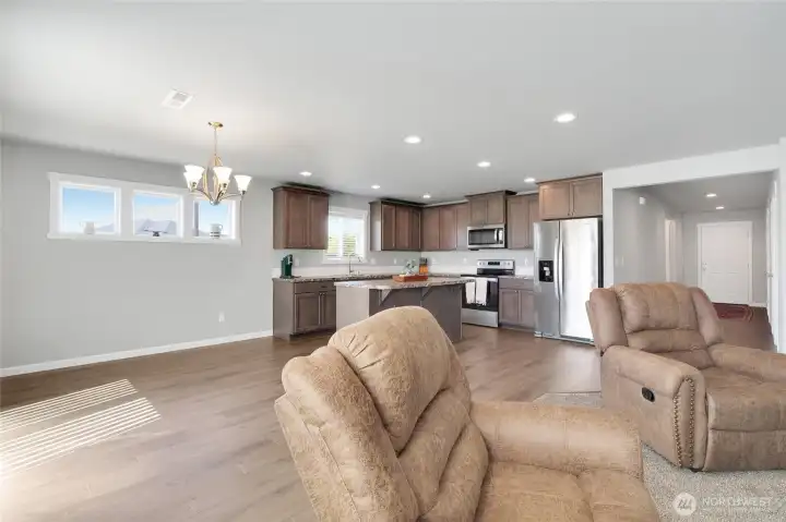 Wide angle of kitchen to dining room.