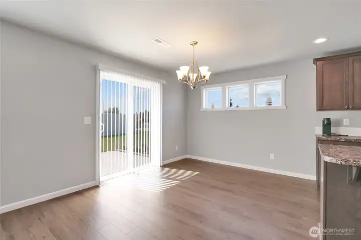 Large dining room area connecting to the back patio.
