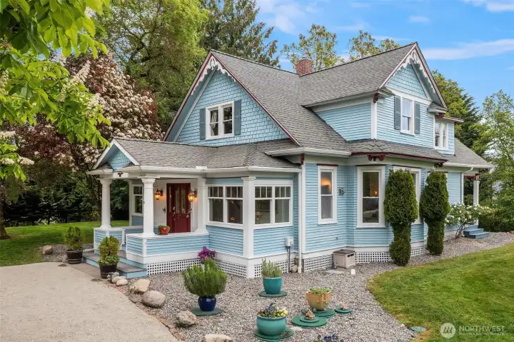 Welcome to this gracious and iconic Victorian home sited on a lovely knoll within minutes to ferries to Seattle!
