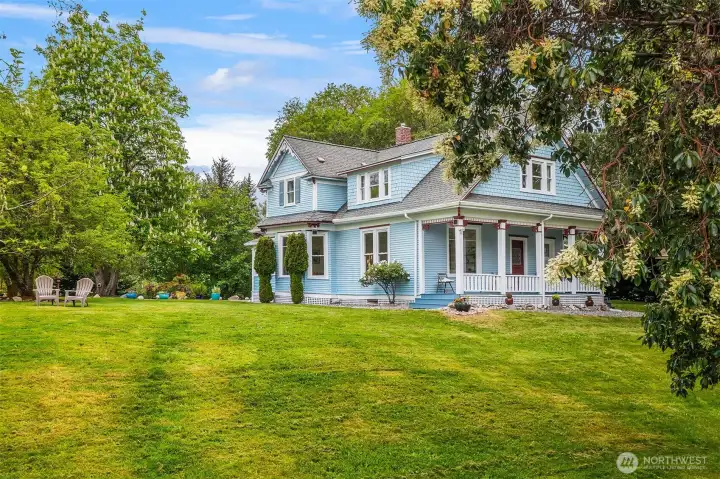 This is the east-facing side of the home. Gracious porch is lovely on a hot summer afternoon.