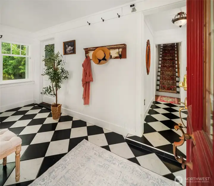 Tiled entry is a generous and versatile space with light streaming in from three sides.