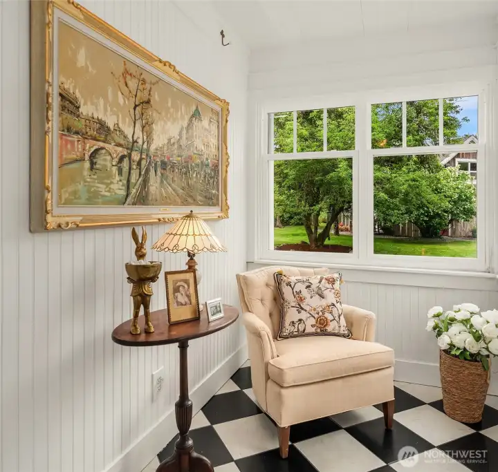 Bead board walls, tiled floors and so many windows make the entry a very charming space.
