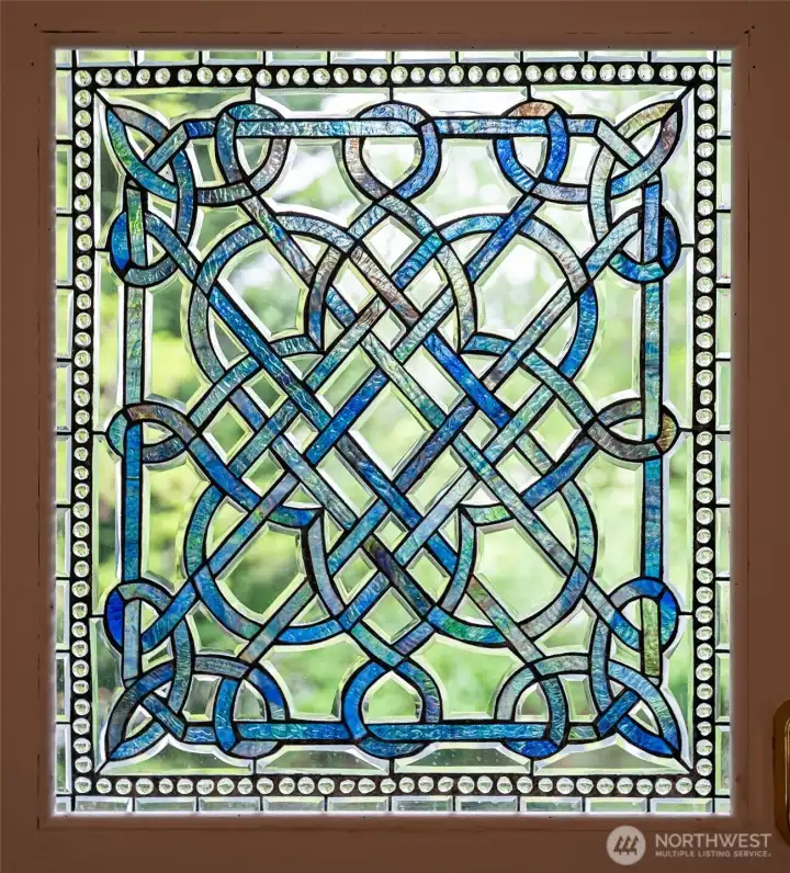 Wow! Truly stunning stained glass in dining room door.