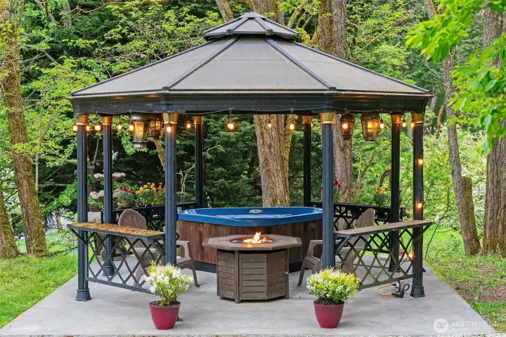 Gazebo is a nice spot to unwind around the fire or in the hot tub. Owners love this spot!