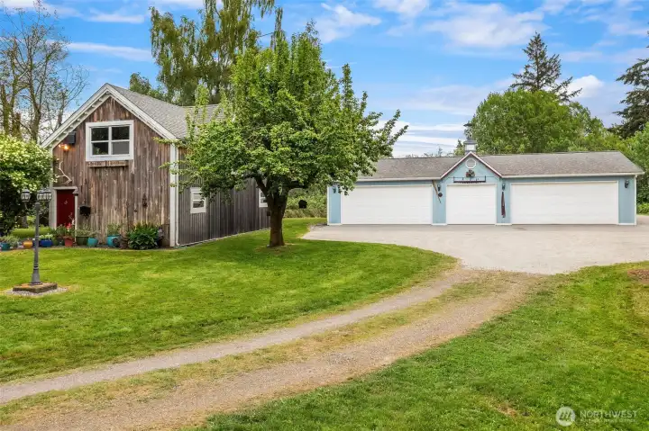 Carriage house and four-car garage. Garage has another studio space built out into the southwest corner. Could be converted back to parking.