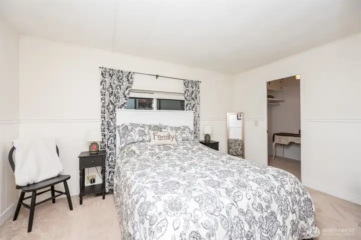 Primary bedroom with walk-in closet