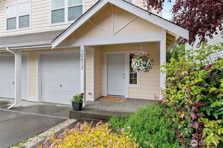 Covered Porch & Individual Garage w/ Storage Space!
