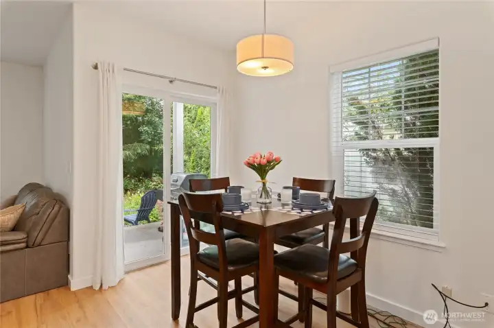 Dining Area Views the Back Patio and Charming Garden Space!