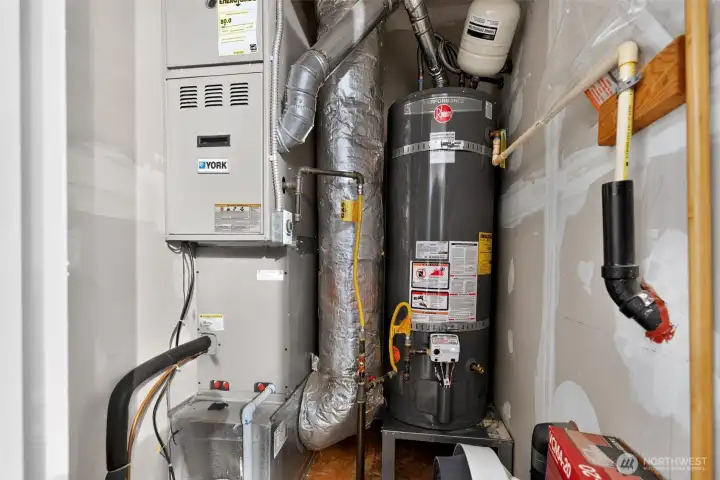 Mechanical Room located inside of garage - has door and light inside Mechanical Room located inside of garage - has door and light inside