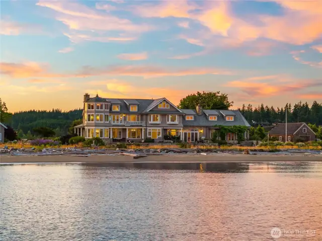 This wonderful Hamptons-style home, nestled within a small gated estate community, beautifully captures the timeless elegance of the Robert A. M. Stern design. The home’s shingle and stone exterior, accented by distinctive copper-topped turrets, merges classic East Coast sophistication with a distinct Northwest flair.