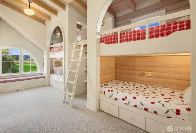 The children’s wing is a stroke of genius, featuring a boys’ bunk room and a girls’ bunk room, each with its own bathroom. The bunk room sleeps 6, not shown is sleeping chest with a fold our bed.