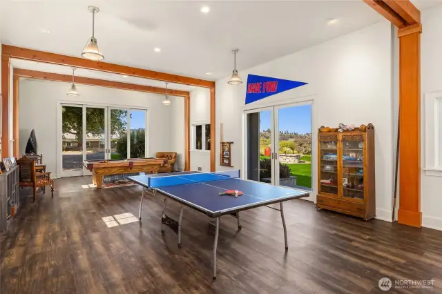 this light-filled outbuilding is around 1,200 sf and includes a small office, a large game/bonus room, and a ½ bath. I could see a shuffleboard here!